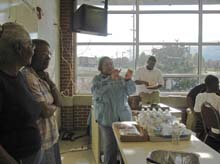 Mrs. Moten speaks to players
